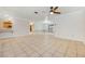 Open living area with tile floors and ceiling fan at 1313 Harbor Blvd, Port Charlotte, FL 33952