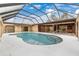 Stunning inground pool with a screened enclosure, perfect for outdoor enjoyment at 1313 Harbor Blvd, Port Charlotte, FL 33952