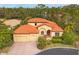 Luxury house with three-car garage and manicured landscaping at 135 N Creek Ln, Osprey, FL 34229