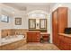 Elegant bathroom with soaking tub, double vanity, and ample storage at 135 N Creek Ln, Osprey, FL 34229