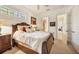 Bright bedroom with queen bed and access to a shared bathroom at 135 N Creek Ln, Osprey, FL 34229