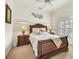 Well-lit bedroom with a comfortable bed and plenty of space at 135 N Creek Ln, Osprey, FL 34229