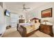 Charming bedroom with a comfortable bed, nightstands, and decorative accents at 135 N Creek Ln, Osprey, FL 34229