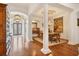 Elegant dining room with hardwood floors and a charming tapestry at 135 N Creek Ln, Osprey, FL 34229