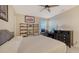 Bedroom with desk, dresser and large bed at 15009 18Th E Run, Parrish, FL 34219