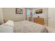 Serene bedroom with dresser and mounted TV at 15009 18Th E Run, Parrish, FL 34219