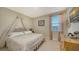 Spacious bedroom with canopy bed and large window at 15009 18Th E Run, Parrish, FL 34219