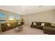 Bright bonus room, featuring a sectional sofa and sunset view at 15009 18Th E Run, Parrish, FL 34219