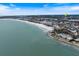 Aerial view of coastal property with beach and ocean at 1604 Stickney Point Rd # 102, Sarasota, FL 34231