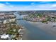 Aerial view showcasing waterfront property and canal at 1604 Stickney Point Rd # 102, Sarasota, FL 34231