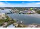 Aerial view of waterfront property with boat docks and canal at 1604 Stickney Point Rd # 102, Sarasota, FL 34231