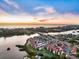 Community overview showcasing waterfront location and sunset views at 1604 Stickney Point Rd # 102, Sarasota, FL 34231