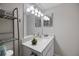 Double vanity bathroom with a large mirror and granite countertop at 1604 Stickney Point Rd # 102, Sarasota, FL 34231