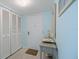 Bright condo entryway with coat closet and decorative table at 1604 Stickney Point Rd # 102, Sarasota, FL 34231