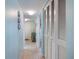 Condo hallway with light walls and built-in storage at 1604 Stickney Point Rd # 102, Sarasota, FL 34231