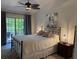 Spacious bedroom with private access to an outdoor patio at 1666 Pintail Way # 9, Sarasota, FL 34231