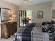 Guest bedroom with twin beds and access to private patio at 1666 Pintail Way # 9, Sarasota, FL 34231