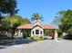 Community entrance to the Landings with terracotta roof and well-maintained grounds at 1666 Pintail Way # 9, Sarasota, FL 34231