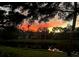 Stunning sunset view of home and surrounding landscape at 1666 Pintail Way # 9, Sarasota, FL 34231