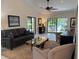 Spacious living room with a view of the backyard and plenty of natural light at 1666 Pintail Way # 9, Sarasota, FL 34231