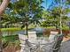 Inviting outdoor patio offers seating with beautiful views of the lake and water fountain at 1666 Pintail Way # 9, Sarasota, FL 34231