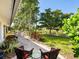 Brick patio with seating area overlooking scenic water views and lush landscaping at 1666 Pintail Way # 9, Sarasota, FL 34231