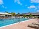 Resort-style pool with ample deck space and lounge chairs at 1666 Pintail Way # 9, Sarasota, FL 34231