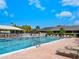 Community swimming pool with lap lanes, sun loungers, and a wading area at 1666 Pintail Way # 9, Sarasota, FL 34231