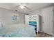 Bedroom with a sea turtle themed comforter and a colorful dresser at 1956 Massachusetts Ave, Englewood, FL 34224