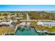 Aerial view of canal-front property with boat dock at 1956 Massachusetts Ave, Englewood, FL 34224