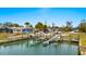 Double boat dock with multiple lifts at 1956 Massachusetts Ave, Englewood, FL 34224