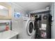 Laundry room with washer, dryer, and sink at 1956 Massachusetts Ave, Englewood, FL 34224