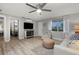 Open living space with light floors, a sofa, and a view of the bedroom at 1956 Massachusetts Ave, Englewood, FL 34224