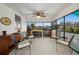 Relaxing screened porch with seating at 1956 Massachusetts Ave, Englewood, FL 34224