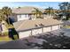 Aerial view of building showing three-car garages and surrounding landscape at 200 Mirabella Cir # 201, Venice, FL 34292