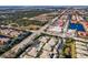 Wide aerial view of community, roads, and surrounding area at 200 Mirabella Cir # 201, Venice, FL 34292