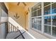 Condo entryway with screened-in porch and nautical decor at 200 Mirabella Cir # 201, Venice, FL 34292