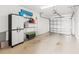 Attached garage with ample storage shelving and space for a vehicle at 200 Mirabella Cir # 201, Venice, FL 34292