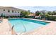 Refreshing community pool with plenty of lounge chairs at 200 Mirabella Cir # 201, Venice, FL 34292