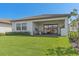 Covered patio with seating area and lush lawn at 2114 5Th E St, Palmetto, FL 34221