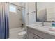 Bathroom with gray tile, bathtub, and modern vanity at 2114 5Th E St, Palmetto, FL 34221