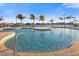 Relaxing community pool with palm trees and seating at 2114 5Th E St, Palmetto, FL 34221