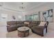 Relaxing living room featuring a sectional sofa and a modern coffee table at 2114 5Th E St, Palmetto, FL 34221