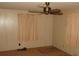 Bedroom with window, ceiling fan, and neutral walls at 232 Trailorama Dr, North Port, FL 34287