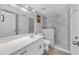 Clean bathroom, featuring a walk-in shower and white vanity at 235 64Th St, Holmes Beach, FL 34217