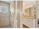 Spa-like bathroom with a walk-in shower, grab bars and updated fixtures at 2424 Post Rd, Sarasota, FL 34231