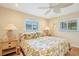 Guest bedroom with two nightstands and leafy bedding at 2424 Post Rd, Sarasota, FL 34231