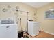 Convenient laundry room with washer, dryer, and extra storage at 2424 Post Rd, Sarasota, FL 34231