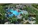 Resort-style pool with lounge chairs and a clubhouse at 26858 Weiskopf Dr, Englewood, FL 34223