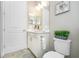 Clean bathroom with vanity, toilet and plant at 26858 Weiskopf Dr, Englewood, FL 34223